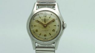 Gentlemen's Midia Vintage Wristwatch, circular patina dial with gilt hour and baton marker, stepped