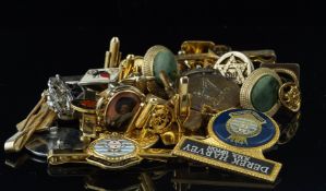 Collection of yellow metal brooches, cufflinks and tie pins, including military, and a compass