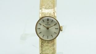 Ladies' Omega 9ct, circular dial, integrated bracelet, stamped and tested 9ct, manual wind movement,