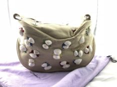 LULU GUINESS- A Lulu Guinness hessian beach bag with sea shell detail, and dust cover, L 38 H 24 W