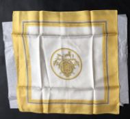 HERMES- A Hermes Caleche yellow and white silk scarf, with tag, measures approximately 44 x 44cm