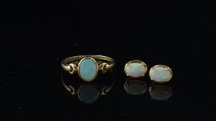 Single stone opal ring, oval cut opal, set in 9ct yellow gold ring size O, together with a pair of