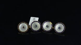 A pair of sapphire, mother of pearl and enamel cufflinks, cabochon sapphire to the centre of a
