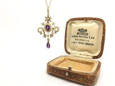 Edwardian amethyst and seed pearl pendant brooch, bright central oval cut amethyst set with a border