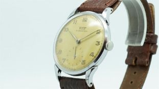 Gentlemen's Tissot Vintage Wristwatch, circular patina dial with arabic numerals and a large