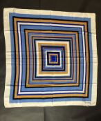 GUY LARACHE- A vintage Guy Laroche blue, white and tan scarf, approximately 87 x 87cm