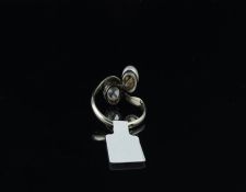 Pearl and diamond two stone twist ring, old mine cut diamond and 5.88mm white pearl, mounted in