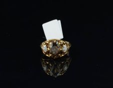 Quartz and diamond ring, central round cut quartz, set with a round brilliant cut diamond to each