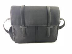 CHRISTIAN DIOR- A Christian Dior Homme satchel, a black canvas with white metal fittings, inner