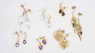 Seven pairs of 9ct yellow gold gem set drop earrings, gross weight approximately 10.8 grams