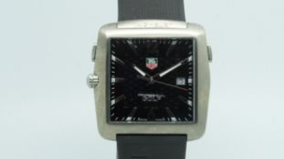 Gentlemen's Tag Heuer Gold Professional, square black dial with date aperture