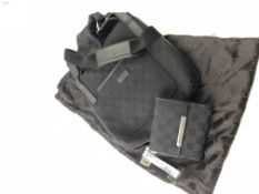 GUCCI- A black GG Monogram canvas cross body bag B