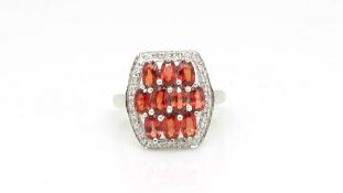 Garnet and diamond dress ring, in 9ct white gold, ring size O