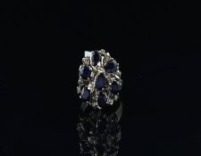 Sapphire and diamond tiered cluster ring, set with oval cut sapphires and single cut diamonds, in