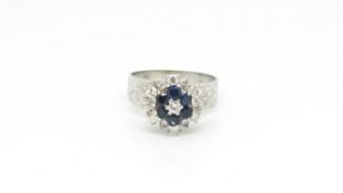 Sapphire and diamond cluster ring, raised setting, thick textured band, in white metal tested as