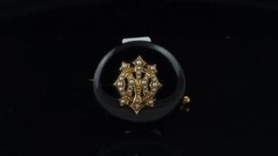 Pearl and enamel mourning brooch, central pearl monogram, surrounded by black enamel, with a