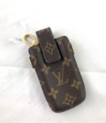 LOUIS VUITTON- A Monogram leather phone holder. Un