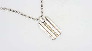 TIFFANY & CO- A silver Atlas pendant, on a silver chain, both signed, chain approximately 44cm
