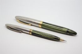 Vintage W.A Sheaffer fountain pen and pencil set, green marbled finish, steel and gold tops, each