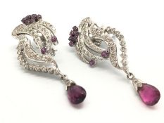 A pair of ruby and diamond spray earrings, set with round cut rubies and round brilliant cut