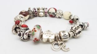 PANDORA- A Pandora charm bracelet with 18 mainly Christmas themed charms, length approximately 18cm