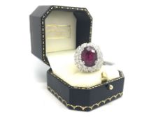 Ruby and diamond cluster ring, 8.16ct oval cut ruby, mounted with 24 brilliant cut diamonds,