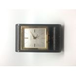 Vintage Jaeger LeCoultre '8 Day' Alarm Clock, square linen dial gold baton hour markers.