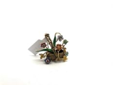 Enamel and gem set floral basket brooch, rope detail gold basket, with articulated diamond, ruby,