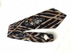 CHRISTIAN DIOR- A Christian Dior silk kipper tie, floral and ribbon detail with Christian Dior and