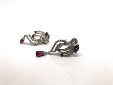 A pair of ruby and diamond spray earrings, set with round cut rubies and round brilliant cut