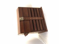 Large brown leather jewellery case, top case section and five drawers, combination lock, measures H-