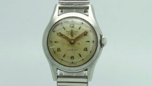 Gentlemen'sÂ Midia Vintage Wristwatch, circular patina dial with gilt hour and baton marker, stepped