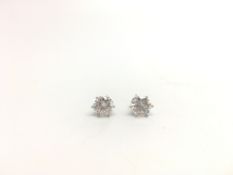 A pair of brilliant cut diamond stud earrings, estimated diamond weight 1.30ct each (2.60ctETDW),