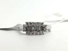 Diamond cluster ring, central row of baguette cut diamonds, surrounded by round brilliant cut