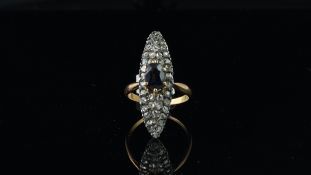 Sapphire and diamond ring, navette shaped design with a central oval cut sapphire, surrounded by