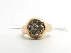 Diamond cluster ring, central eight stone diamond cluster, in a heavy gold getting, hallmarked 14ct,