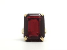 Red stone dress ring, large emerald cut red stone, mounted in 9ct yellow gold, ring size L