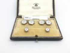 Pearl and mother of pearl dress set comprising a pair of cufflinks, and two studs, stamped 18ct