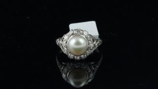 Pearl and diamond cluster ring, 7.25mm pearl set within a cluster of brilliant cut diamonds,