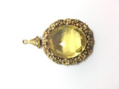 Victorian yellow stone pendant, large faced yellow stone set within an intricate floral, bead and