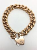 9ct yellow gold bracelet, curb link bracelet, with a heart padlock clasp and safety chain, gross