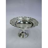 An Edwardian Silver Pedestal Dish, Mappin & Webb, London, 1903 the pierced shaped circular body