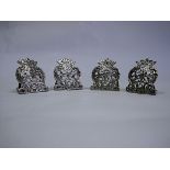 A Set Of Four Silver Place Card Holders, Various Makers, London, 1897 And 1902 each pierced