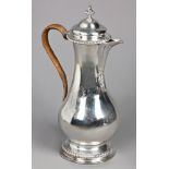 A George III Silver Claret Jug, Augustin Le Sage, London, 1769 the baluster body engraved with a