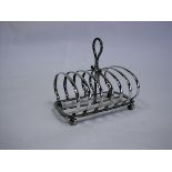 A Victorian Silver Toast Rack, Henry Wilkinson & Co, London, 1894 the rectangular frame centred