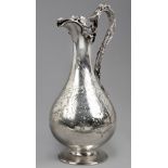 A Victorian Silver Claret Jug, Alexander Macrae, London, 1856 the baluster body chased with