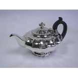 A George IV Silver Teapot, Makers Mark R P, London, 1822 the compressed melon-shaped body with