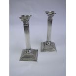 A Pair Of Electroplate Corinthian Candlesticks, Godinger Silver Art Co, 1992 each square stepped