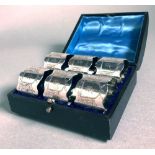 A Cased Set of Six Electroplate Napkin Rings,