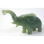 A Carved Jadeite Figure of An Elephant, 20th Century,